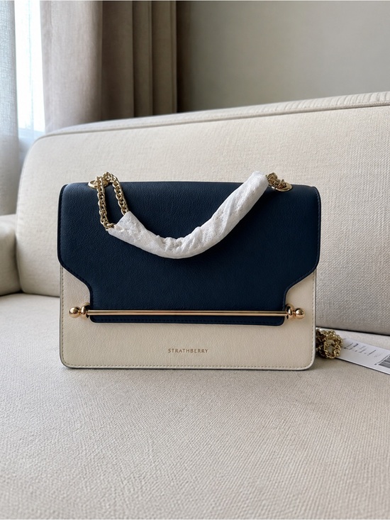 Tory Burch Handbags - Tory Burch Navy and Cream Leather Crossbody with Gold Bar
